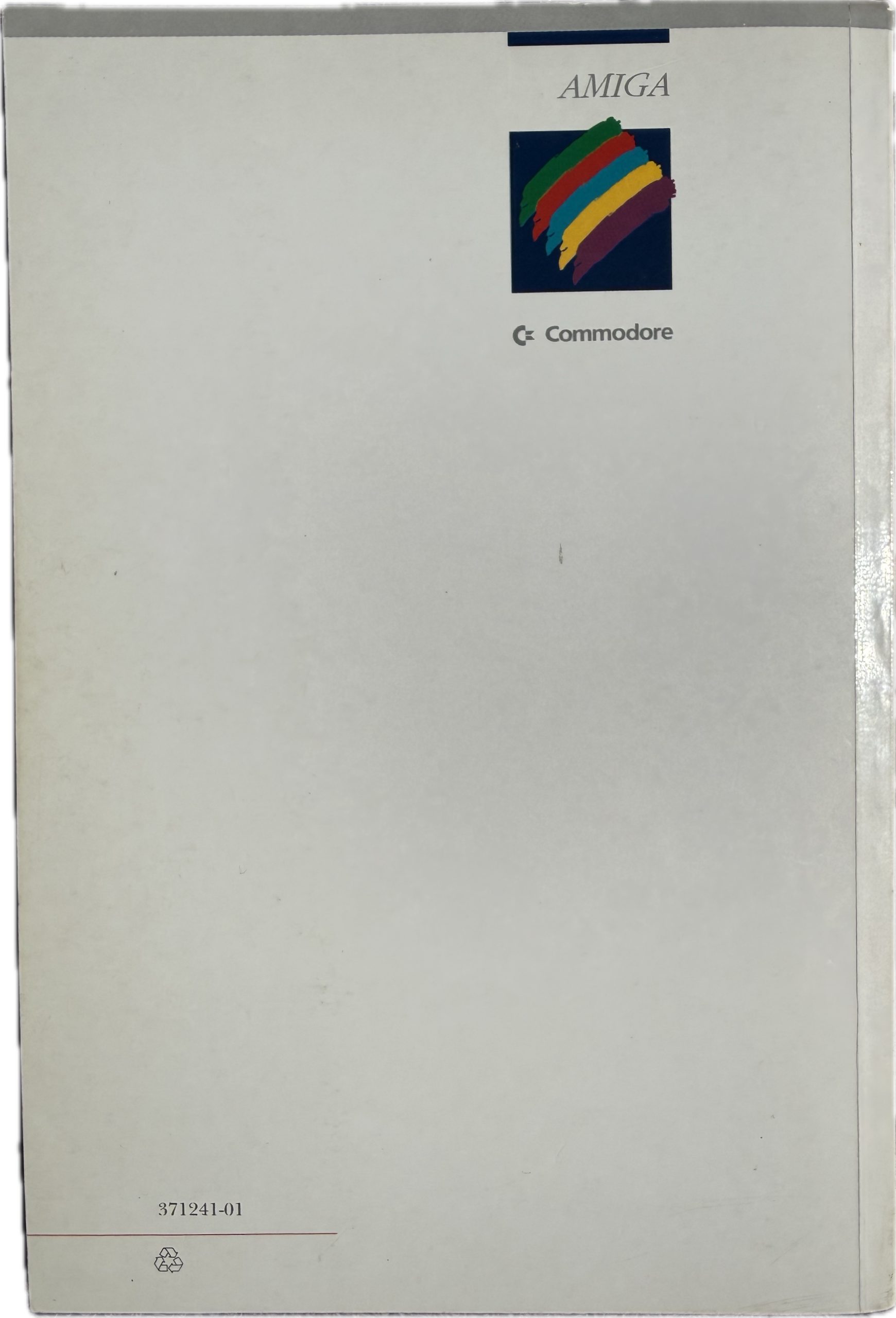 Rear cover of Amiga 1200 User's Manual showing Commodore International logo and colour splash